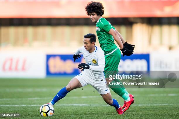 Nor Azam Azih of Malaysia fights for the ball with Safaa Hadi of Iraq during the AFC U23 Championship China 2018 Group C match between Iraq and...
