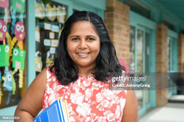 aboriginal teacher at primary school - teacher studio portrait stock pictures, royalty-free photos & images