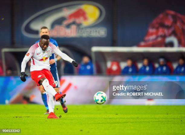 Leipzig´s Guinean midfielder Naby Keita scores the opening goal during the German first division Bundesliga football match between RB Leipzig and FC...