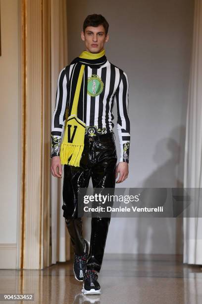 Model walks the runway at the Versace show during Milan Men's Fashion Week Fall/Winter 2018/19 on January 13, 2018 in Milan, Italy.