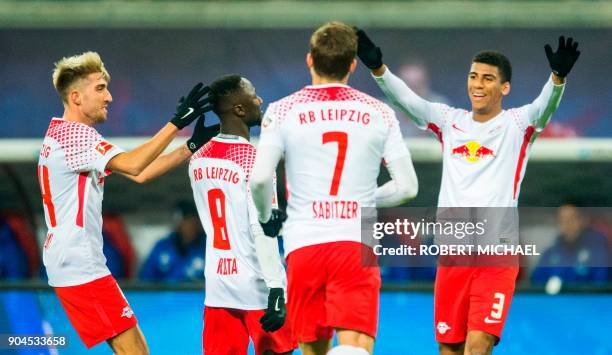 Leipzig´s Guinean midfielder Naby Keita celebrates scoring with his teammates Slovanian midfielder Kevin Kampl, Austrian forward Marcel Sabitzer and...