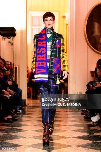 Model presents a creation for fashion house Versace during the Men's Fall/Winter 2019 fashion shows in Milan, on January 13, 2018. / AFP PHOTO /...