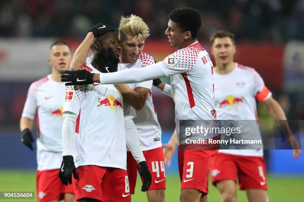 Naby Keita of Leipzig celebrates after he scored a goal to make it 1:0 with Kevin Kampl of Leipzig and Bernardo of Leipzig during the Bundesliga...