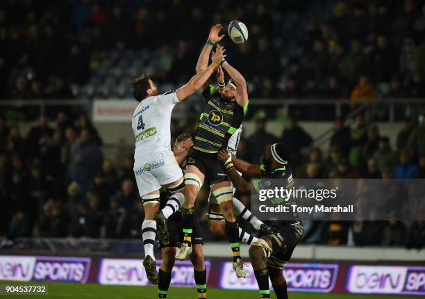 Christian Day of Northampton Saints is tackled by Flip Van Der Merwe of ASM Clermont Auvergne during the European Rugby Champions Cup match between...