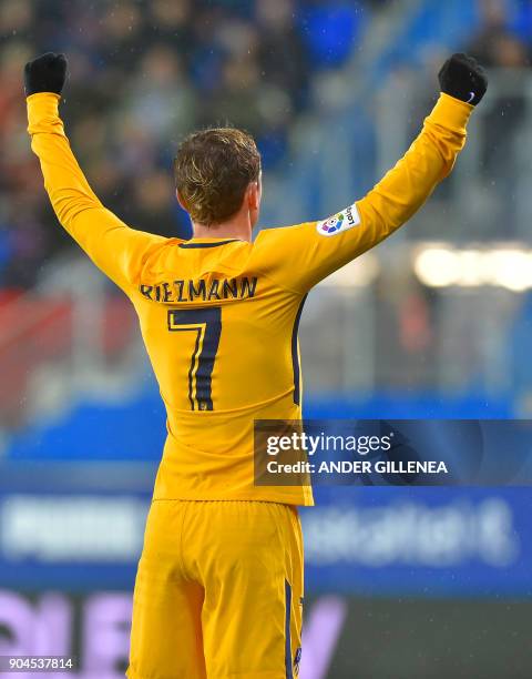 Atletico Madrid's French forward Antoine Griezmann celebrates teammate French forward Kevin Gameiro's goal during the Spanish league football match...