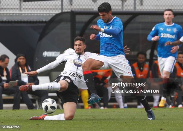 Pedro Henrique of Brazilian club Corinthians makes a sliding tackle against Eduardo Herrera of Scottish club Rangers FC during their Florida Cup...