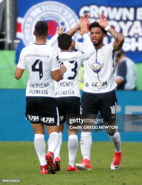 Kazim of Brazilian club Corinthians celebrates with teammates after scoring a first half goal against Scottish club Rangers FC during their Florida...