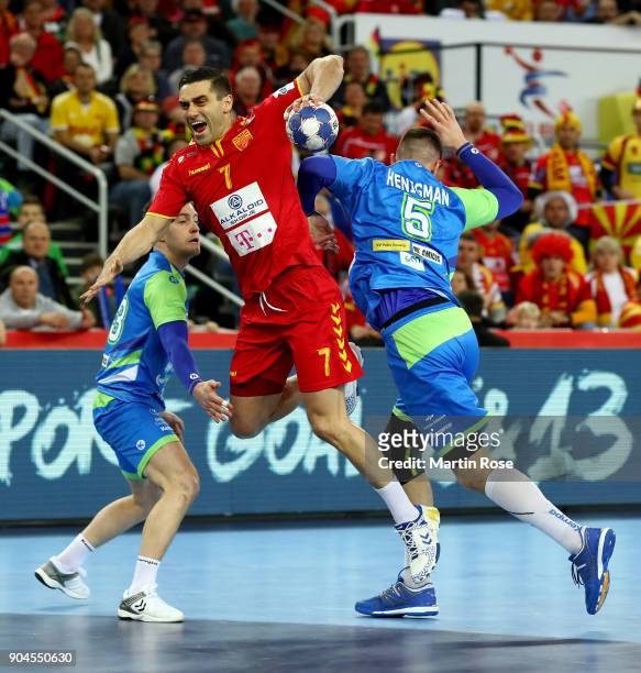 Kiril Lazarov of Macedonia challenges Nik Henigman of Slovenia during the Men's Handball European Championship Group C match between Macedonia and...