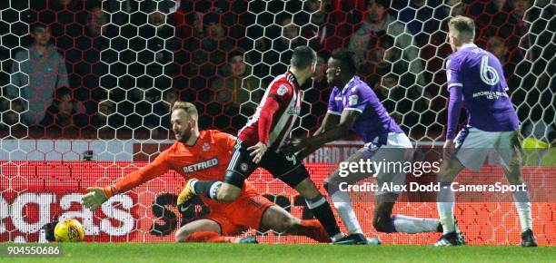 Bolton Wanderers' Ben Alnwick can't keep out Neal Maupay's back heeled shot, making the score 2-0 during the Sky Bet Championship match between...