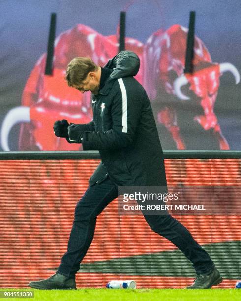 Leipzig´s Austrian head coach Ralph Hasenhuettl celebrates after the German first division Bundesliga football match between RB Leipzig and FC...