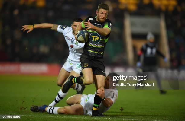 Rob Horne of Northampton Saints charges through the ASM Clermont Auvergne defence during the European Rugby Champions Cup match between Northampton...