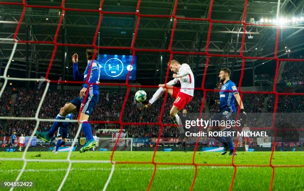 Leipzig´s forward Timo Werner scores during the German first division Bundesliga football match between RB Leipzig and FC Schalke 04 in Leipzig,...
