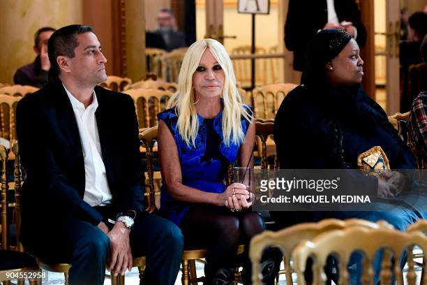 Italian designer Donatella Versace attends the rehearsal of her show during the Men's Fall/Winter 2019 fashion shows in Milan, on January 13, 2018. /...