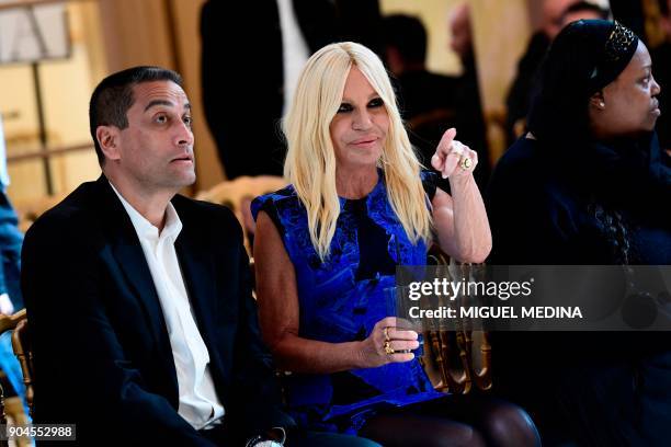 Italian designer Donatella Versace attends the rehearsal of her show during the Men's Fall/Winter 2019 fashion shows in Milan, on January 13, 2018. /...