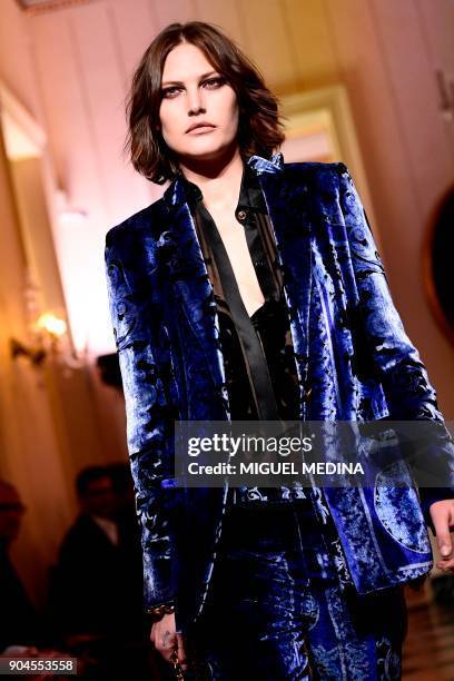 Model Catherine McNeil presents a creation for fashion house Versace during the Men's Fall/Winter 2019 fashion shows in Milan, on January 13, 2018. /...