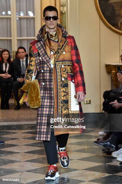 Model walks the runway at the Versace Autumn Winter 2018 fashion show during Milan Menswear Fashion Week on January 13, 2018 in Milan, Italy.