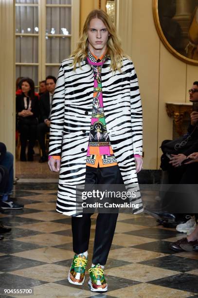 Model walks the runway at the Versace Autumn Winter 2018 fashion show during Milan Menswear Fashion Week on January 13, 2018 in Milan, Italy.