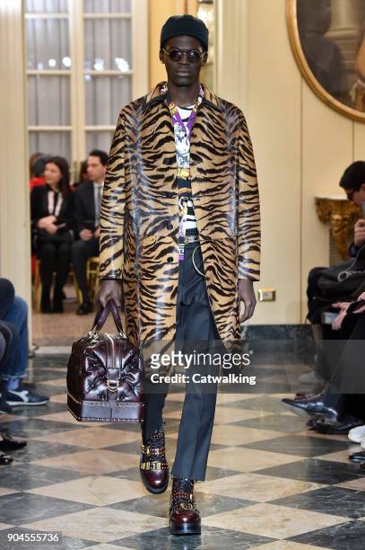 Model walks the runway at the Versace Autumn Winter 2018 fashion show during Milan Menswear Fashion Week on January 13, 2018 in Milan, Italy.