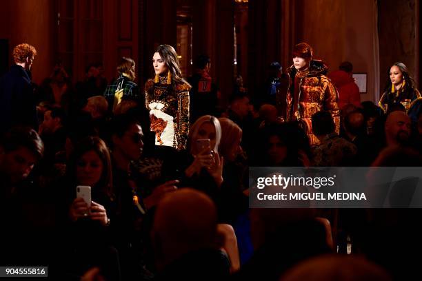 Models present creations for fashion house Versace during the Men's Fall/Winter 2019 fashion shows in Milan, on January 13, 2018. / AFP PHOTO /...