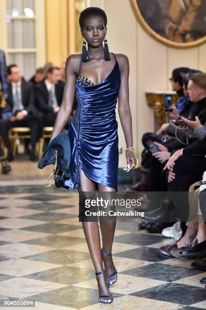 Model walks the runway at the Versace Autumn Winter 2018 fashion show during Milan Menswear Fashion Week on January 13, 2018 in Milan, Italy.
