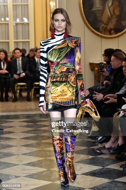 Model walks the runway at the Versace Autumn Winter 2018 fashion show during Milan Menswear Fashion Week on January 13, 2018 in Milan, Italy.