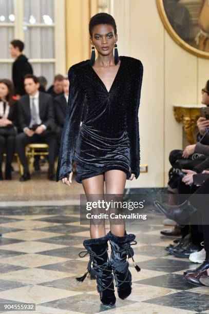 Model walks the runway at the Versace Autumn Winter 2018 fashion show during Milan Menswear Fashion Week on January 13, 2018 in Milan, Italy.