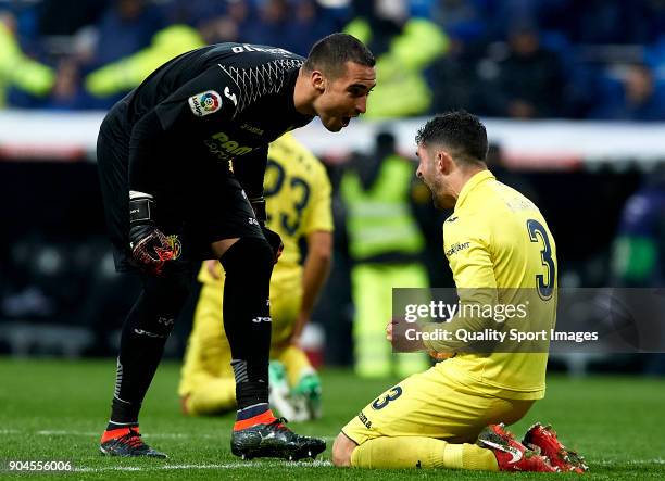 Sergio Asenjo of Villarreal celebrates with his teammate Alvaro Gonzalez during the La Liga match between Real Madrid and Villarreal at Estadio...