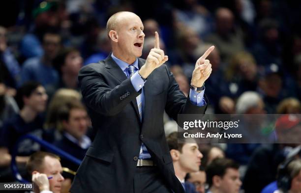 Chris Mack the head coach of the Xavier Musketeers gives instructions to his team against the Creighton Bluejays at Cintas Center on January 13, 2018...