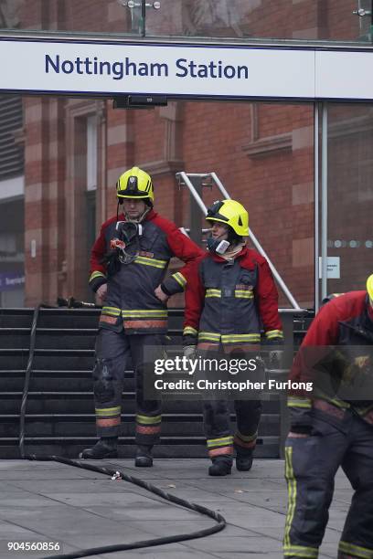 Firefighters continue dampening down and investigating the large fire at Nottingham train station on January 12, 2018 in Nottingham, England. Up to...