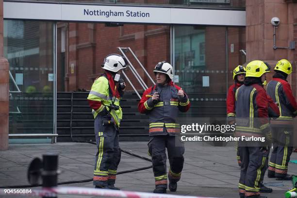 Firefighters continue dampening down and investigating the large fire at Nottingham train station on January 12, 2018 in Nottingham, England. Up to...