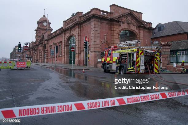 Firefighters continue dampening down and investigating the large fire at Nottingham train station on January 12, 2018 in Nottingham, England. Up to...