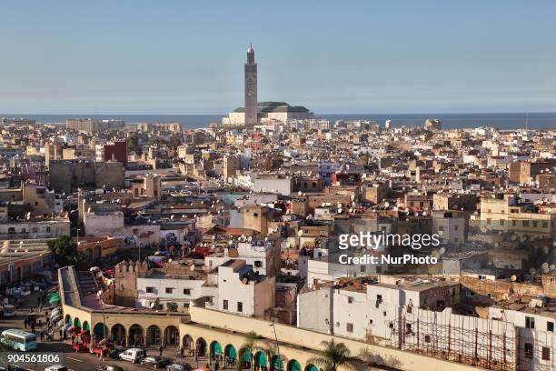 Elevated view of the city of Casablanca in Morocco, Africa. The Hassan II Mosque can be seen in the distance. Hassan II Mosque is the largest mosque...