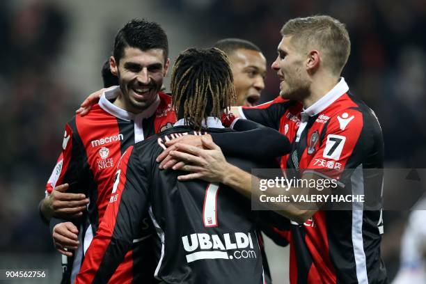Nice's french midfielder Pierre Lees-Melou celebrates with teammates after scoring a goal during the French L1 football match Nice vs Amiens on...
