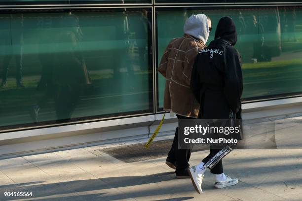 Guests are seen on the set of the Armani Advertising Campaign street style during Milan Men's Fashion Week Fall/Winter 2018/19 on January 13, 2018 in...