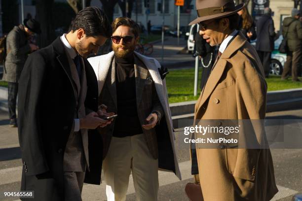 Guests are seen on the set of the Armani Advertising Campaign street style during Milan Men's Fashion Week Fall/Winter 2018/19 on January 13, 2018 in...