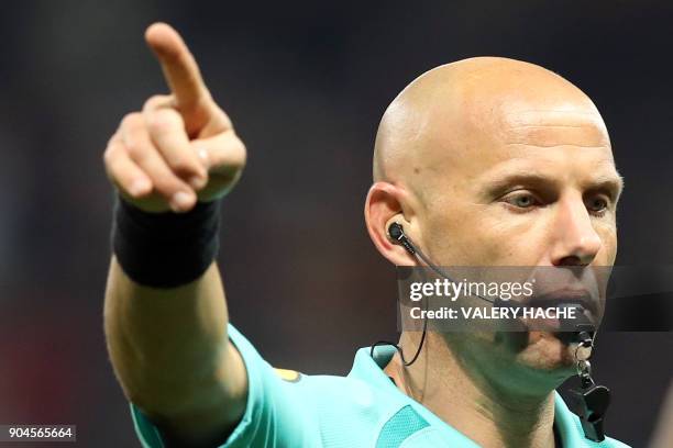 French refeere Amaury Delerue gestures during the French L1 football match Nice vs Amiens on January 13, 2018 at the "Allianz Riviera" stadium in...