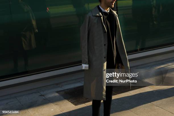 Guest is seen on the set of the Armani Advertising Campaign street style during Milan Men's Fashion Week Fall/Winter 2018/19 on January 13, 2018 in...