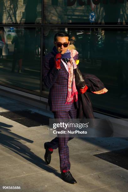 Guest is seen on the set of the Armani Advertising Campaign street style during Milan Men's Fashion Week Fall/Winter 2018/19 on January 13, 2018 in...