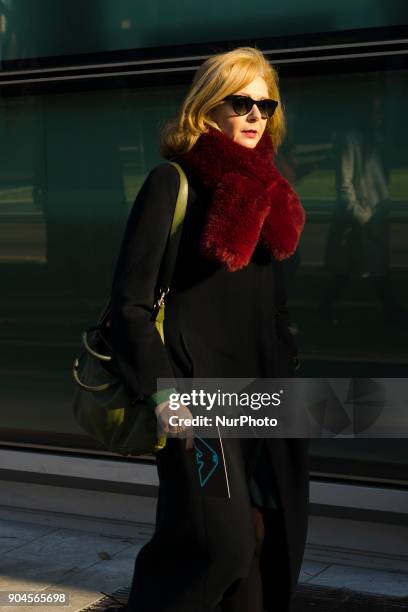 Guest is seen on the set of the Armani Advertising Campaign street style during Milan Men's Fashion Week Fall/Winter 2018/19 on January 13, 2018 in...