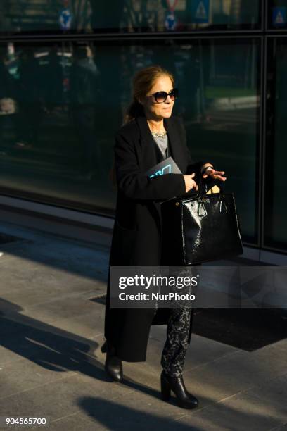 Guest is seen on the set of the Armani Advertising Campaign street style during Milan Men's Fashion Week Fall/Winter 2018/19 on January 13, 2018 in...