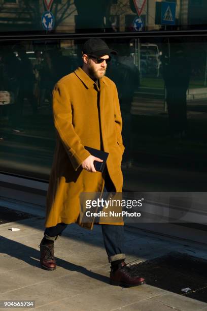 Guest is seen on the set of the Armani Advertising Campaign street style during Milan Men's Fashion Week Fall/Winter 2018/19 on January 13, 2018 in...