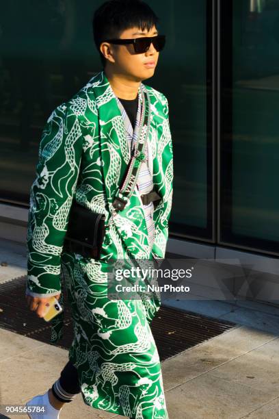 Guest is seen on the set of the Armani Advertising Campaign street style during Milan Men's Fashion Week Fall/Winter 2018/19 on January 13, 2018 in...