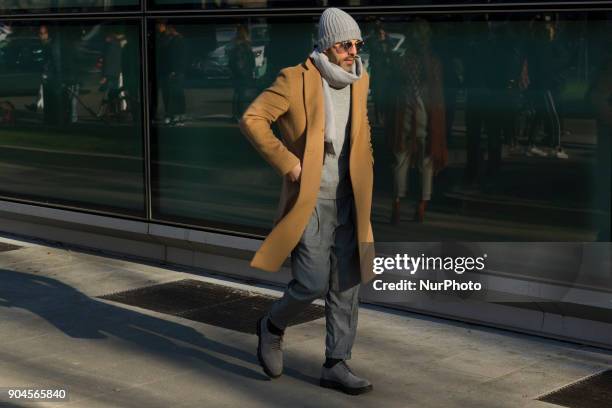 Guest is seen on the set of the Armani Advertising Campaign street style during Milan Men's Fashion Week Fall/Winter 2018/19 on January 13, 2018 in...