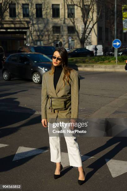 Guest is seen on the set of the Armani Advertising Campaign street style during Milan Men's Fashion Week Fall/Winter 2018/19 on January 13, 2018 in...