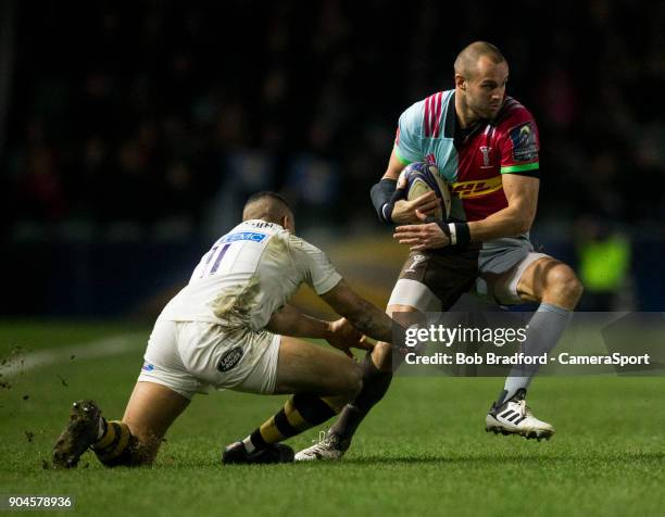 Harlequins' Ross Chisholm evades the tackle of Wasps' Marcus Watson during the European Rugby Champions Cup match between Harlequins and Wasps at...