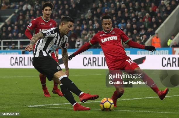 Joselu of Newcastle United scores hie team's first goal during the Premier League match between Newcastle United and Swansea City at St. James Park...
