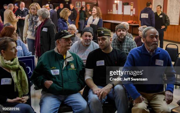 Members of the audience listen to Democrat Conor Lamb, a former U.S. Attorney and US Marine Corps veteran running to represent Pennsylvania's 18th...