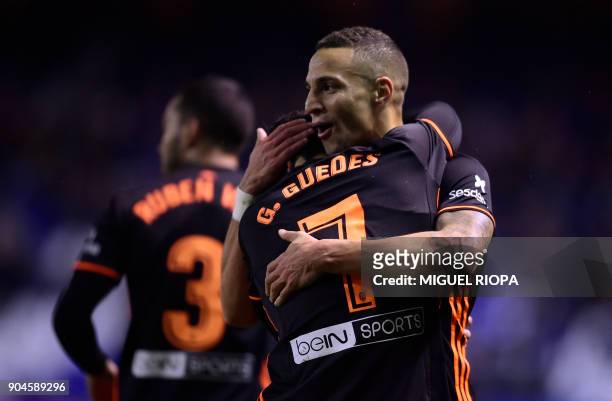 Valencia's Spanish forward Rodrigo Moreno celebrates a goal with Portuguese midfielder Goncalo Guedes during the Spanish league football match...