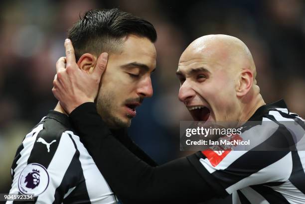 Joselu of Newcastle United celebrates with Jonjo Shelvey after he scores his team's first goal during the Premier League match between Newcastle...