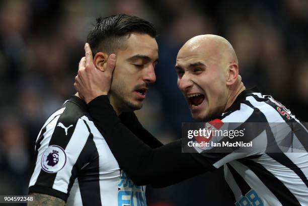Joselu of Newcastle United celebrates with Jonjo Shelvey after he scores his team's first goal during the Premier League match between Newcastle...